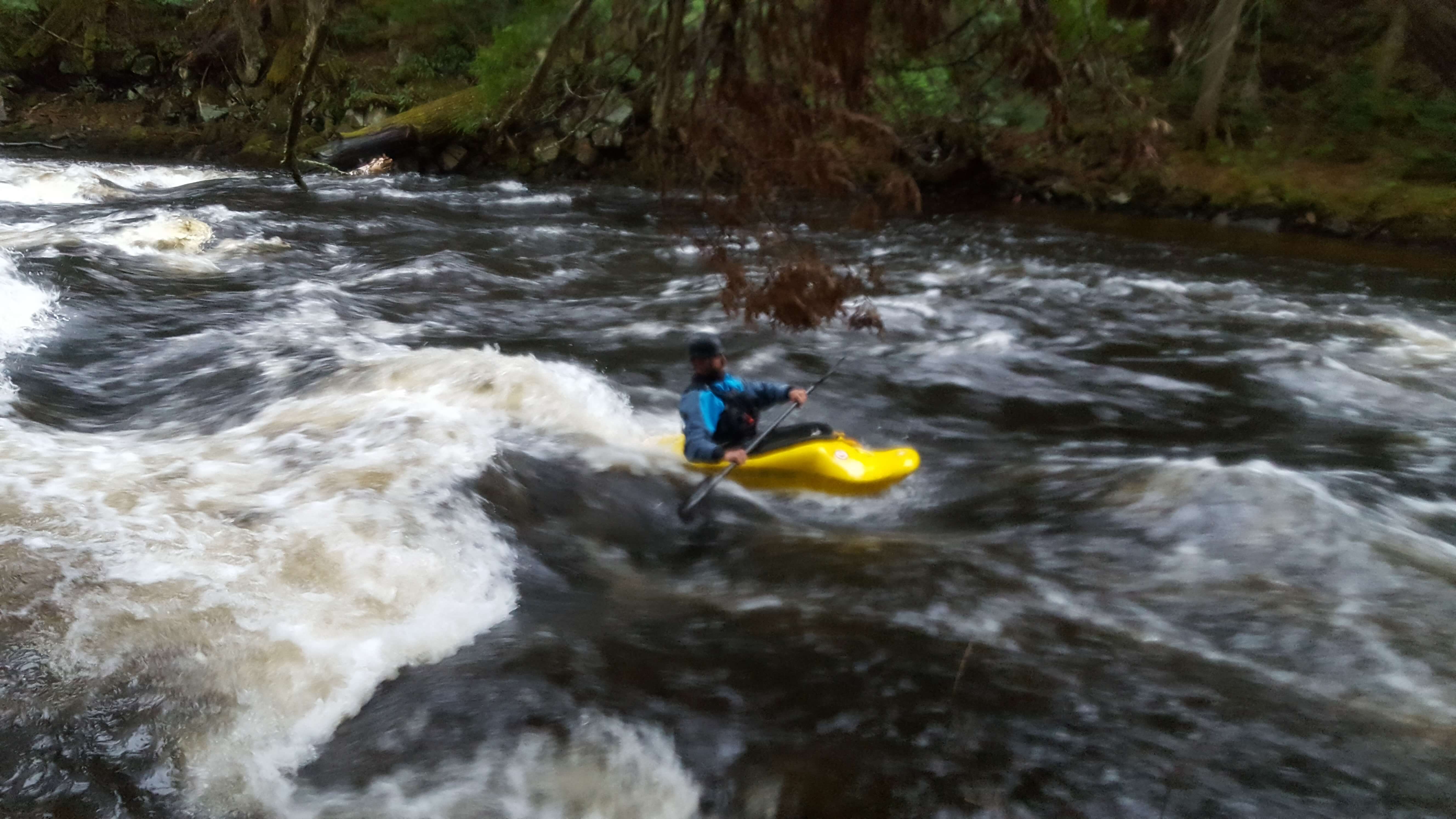 Whitewater kayaker on Permanent Rapids on the Saranac River.