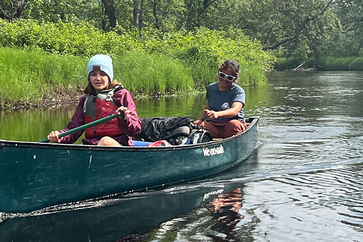 young paddler on the river