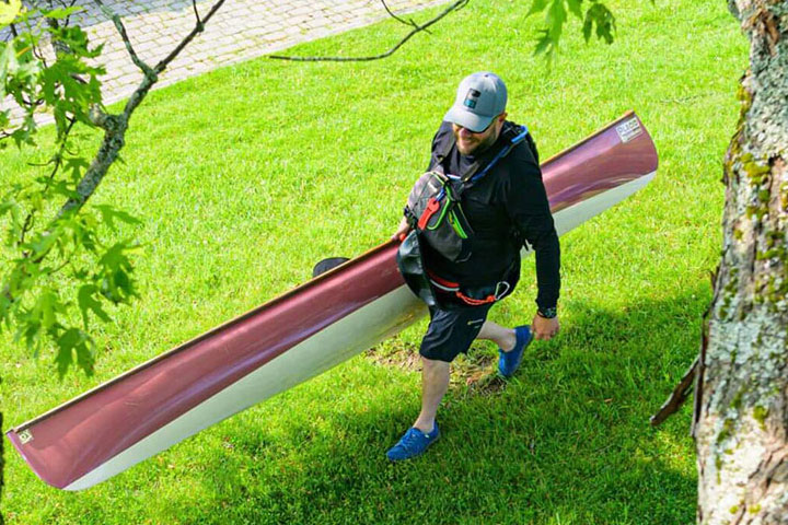 canoer carrying boat