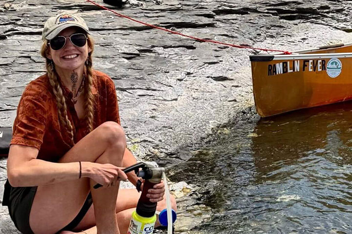 Woman filling water bottle