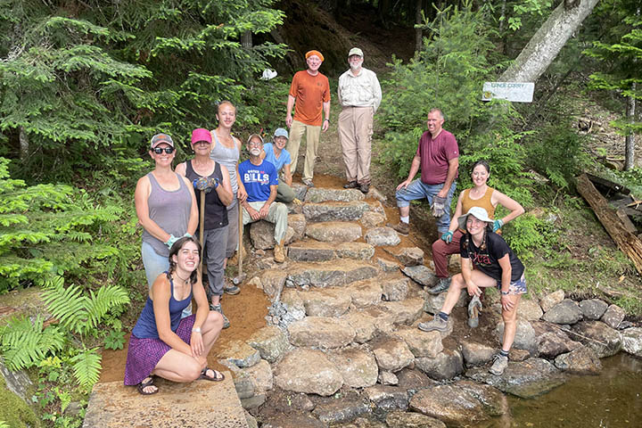 Volunteers and stewardship crew on a Waterway Work Trip near Saranac Lake.